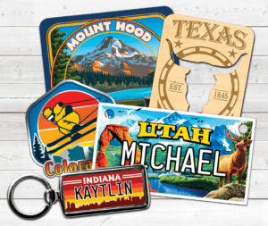 A collection of colorful U.S. state-themed luggage tags and a magnifying glass.